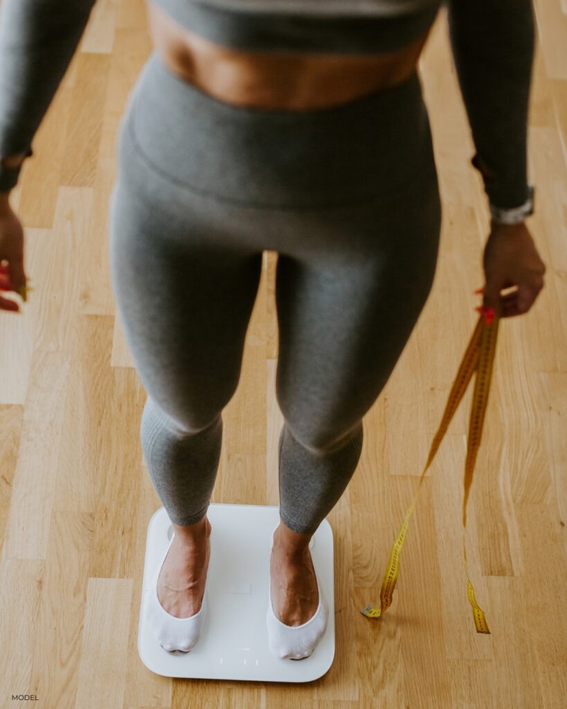 model on a scale reflecting the goal of our weight management program