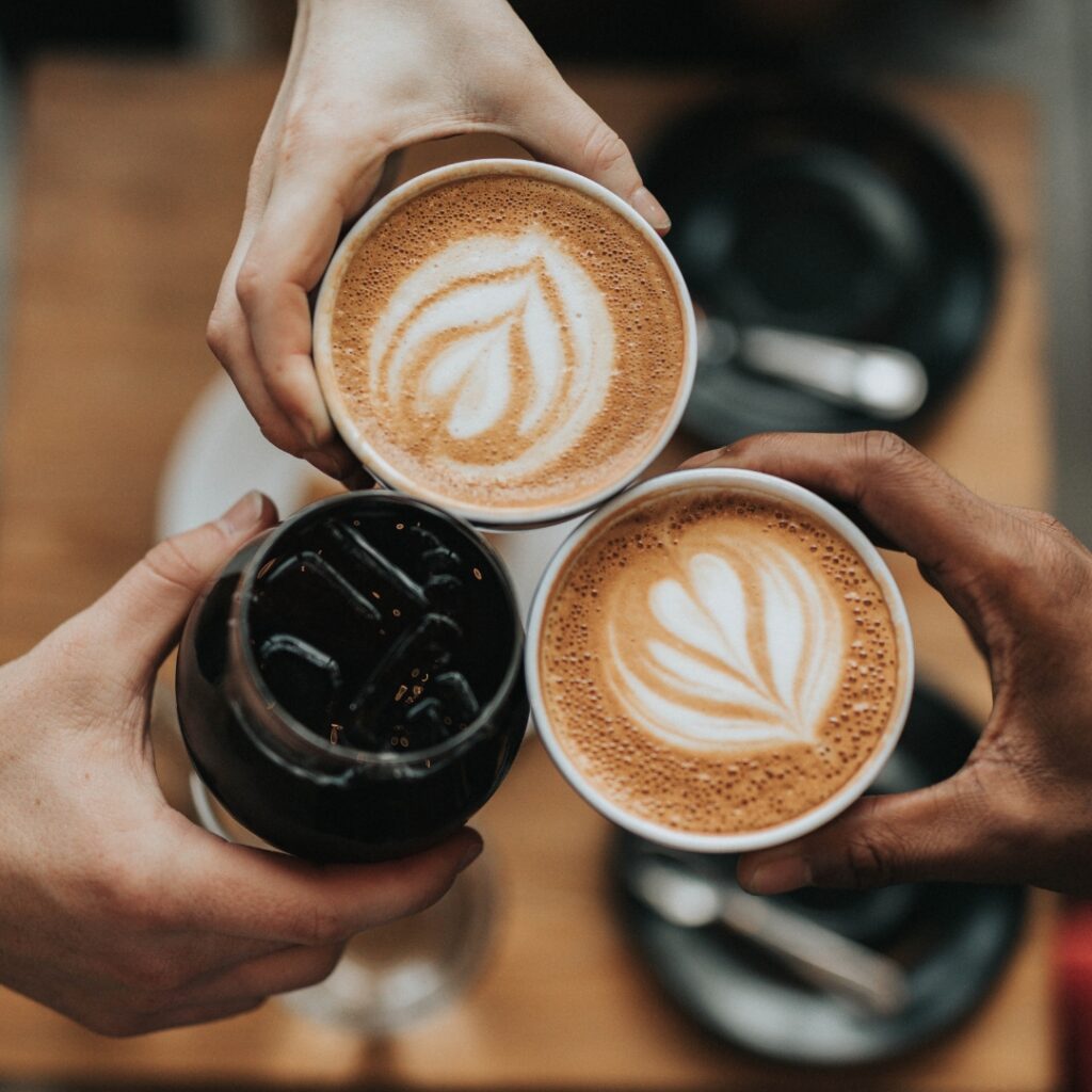 friends enjoying beautiful tasty coffee to represent the theme of our skincare event